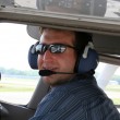 Yea, this would be an inexpensive way to fly, but really would you trust him as your pilot?